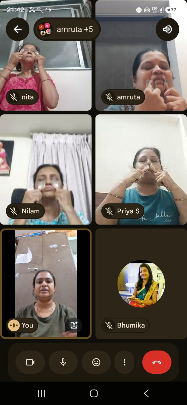 Students practising a guided face yoga routine in a live online session